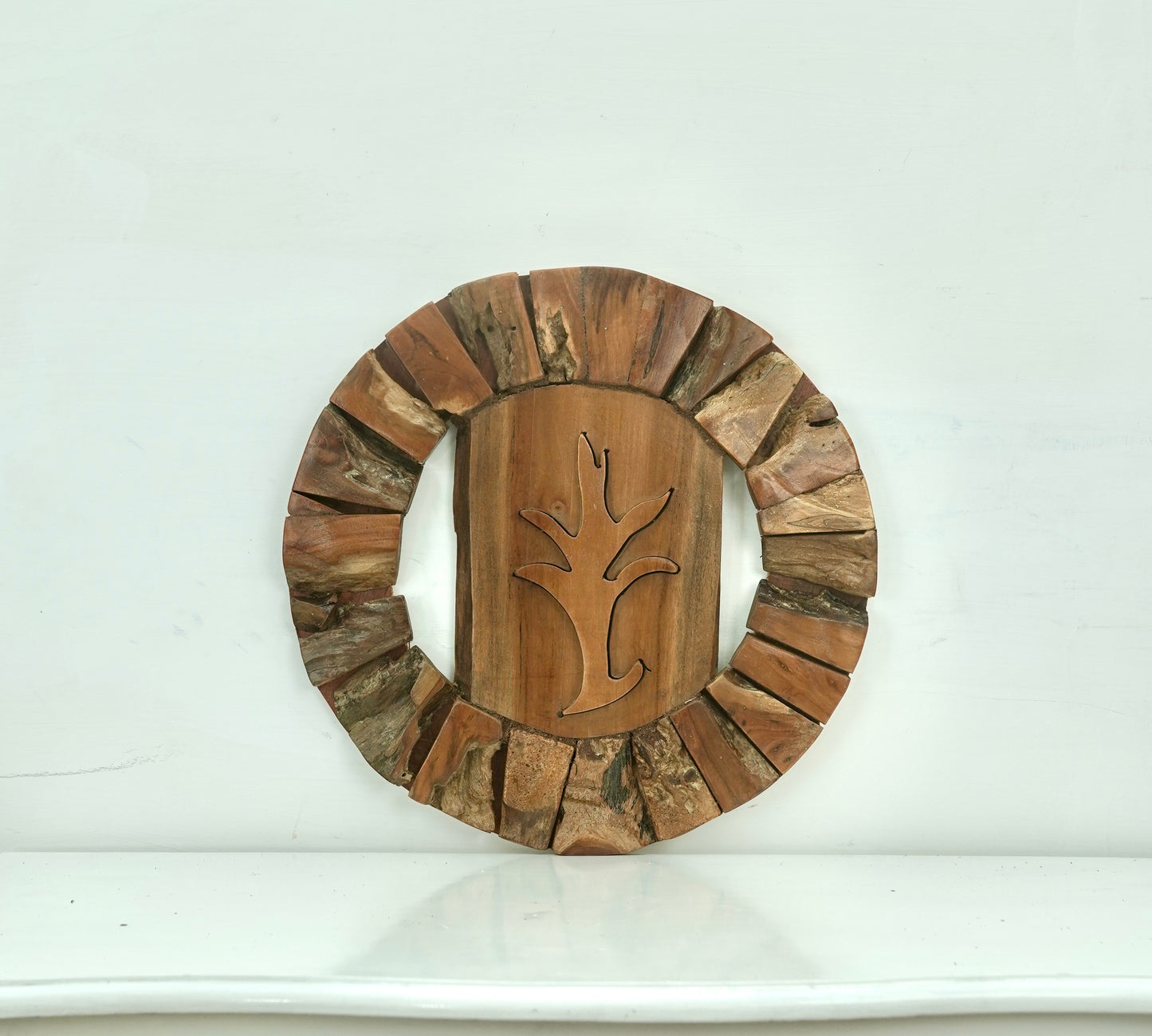 Organic Teak Round Wall Sculpture – Carved Botanical Silhouette